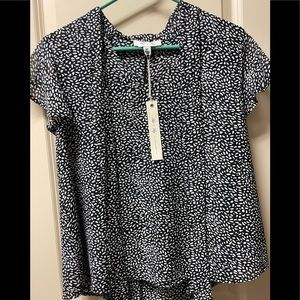 Women’s medium She + Sky black top with white dots.